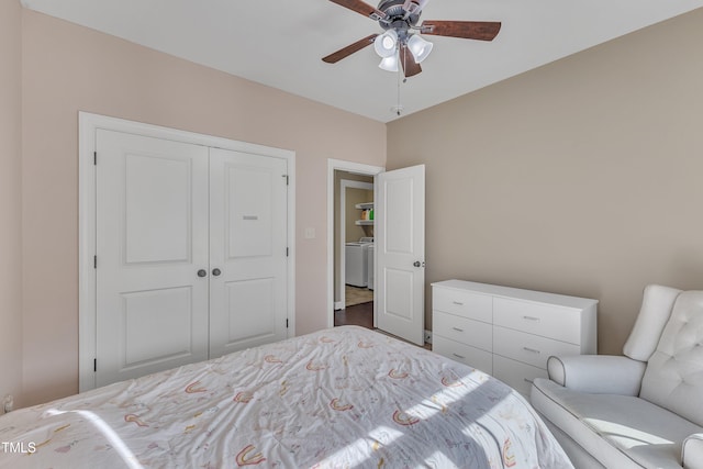 bedroom featuring ceiling fan, washer / clothes dryer, and a closet