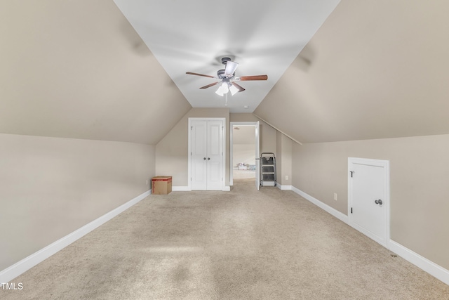 bonus room featuring ceiling fan, carpet, and lofted ceiling