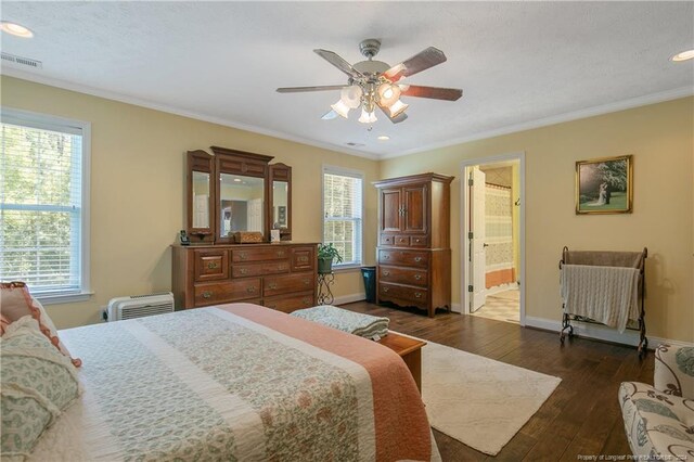 bedroom featuring multiple windows, ceiling fan, dark hardwood / wood-style floors, and ornamental molding