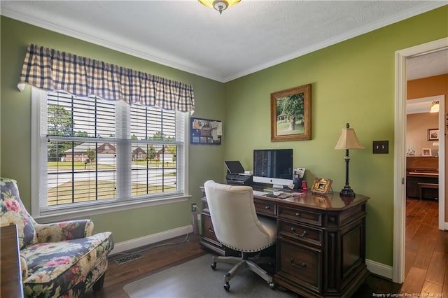 office space featuring wood finished floors, crown molding, and baseboards