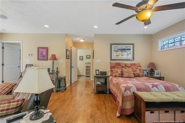 bedroom featuring a ceiling fan, light wood-style flooring, and recessed lighting