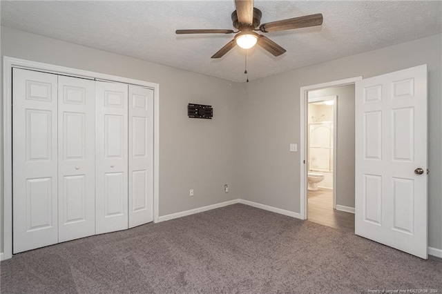 unfurnished bedroom featuring carpet flooring, a textured ceiling, a closet, and ceiling fan