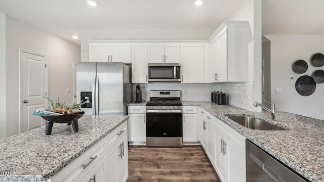 6433 Alfalfa Ln, Wake Forest, NC 27587 - kitchen featuring stainless steel appliances, a sink, white cabinets, dark wood-style floors, and recessed lighting