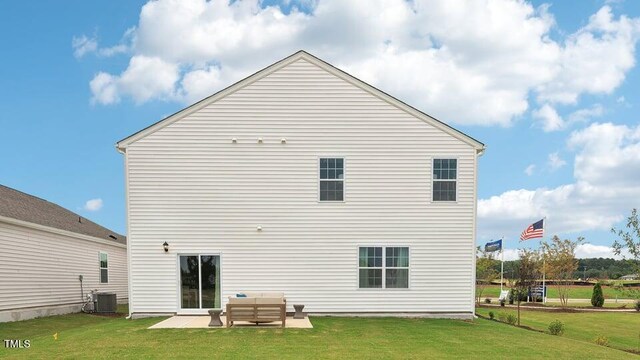 6433 Alfalfa Ln, Wake Forest, NC 27587 - back of property with a lawn, a patio, an outdoor living space, and central AC