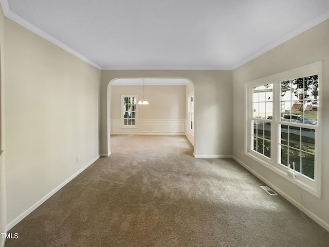 empty room with carpet and ornamental molding