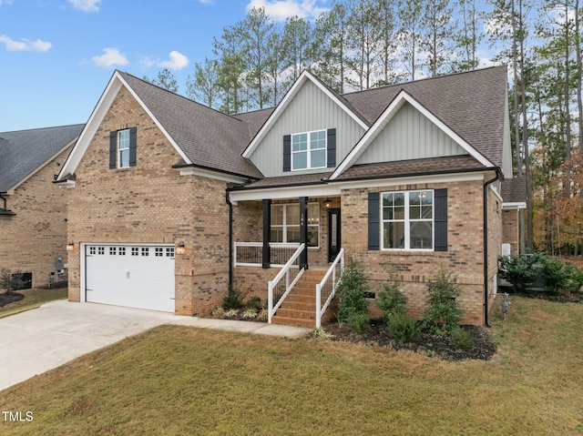 craftsman house featuring covered porch, a garage, and a front yard