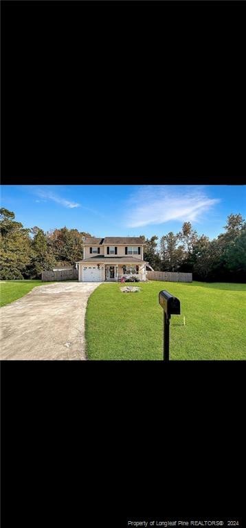 view of front facade featuring a front lawn and a garage