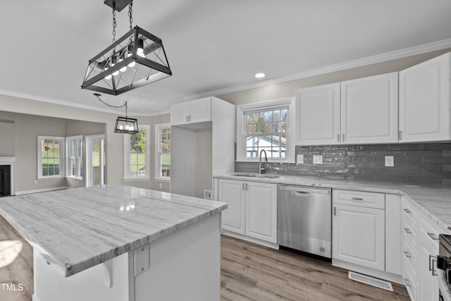 kitchen with white cabinetry, sink, and stainless steel appliances