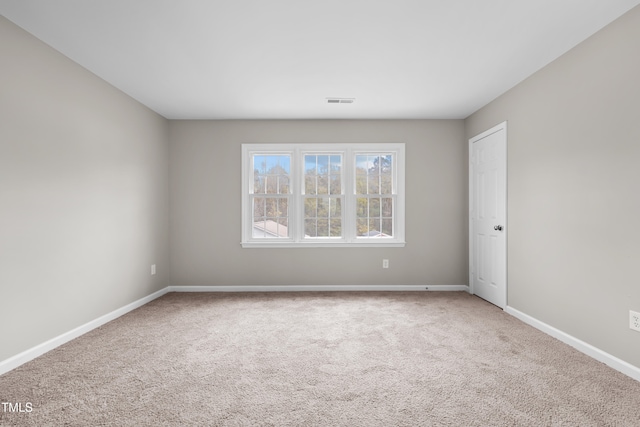 unfurnished room featuring carpet floors