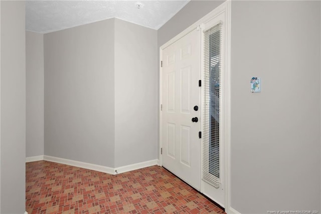 foyer featuring a textured ceiling