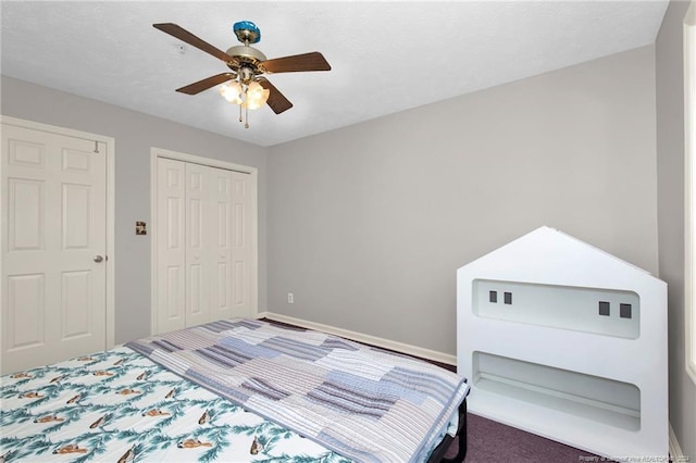 bedroom featuring carpet, ceiling fan, and a closet