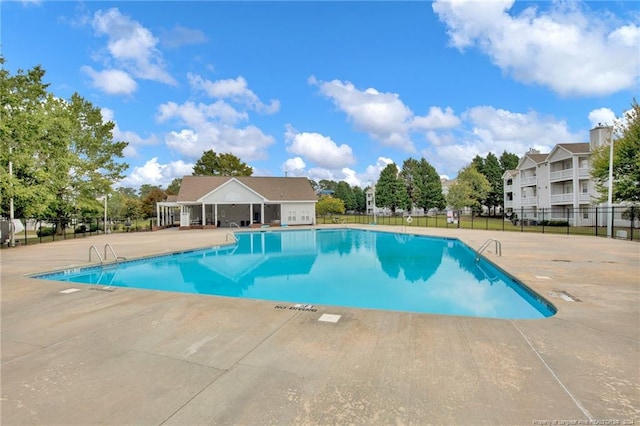 view of swimming pool featuring a patio area