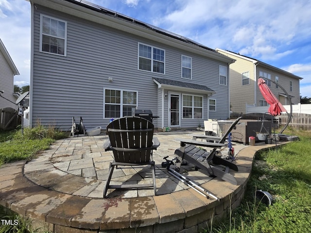 rear view of property featuring a patio area