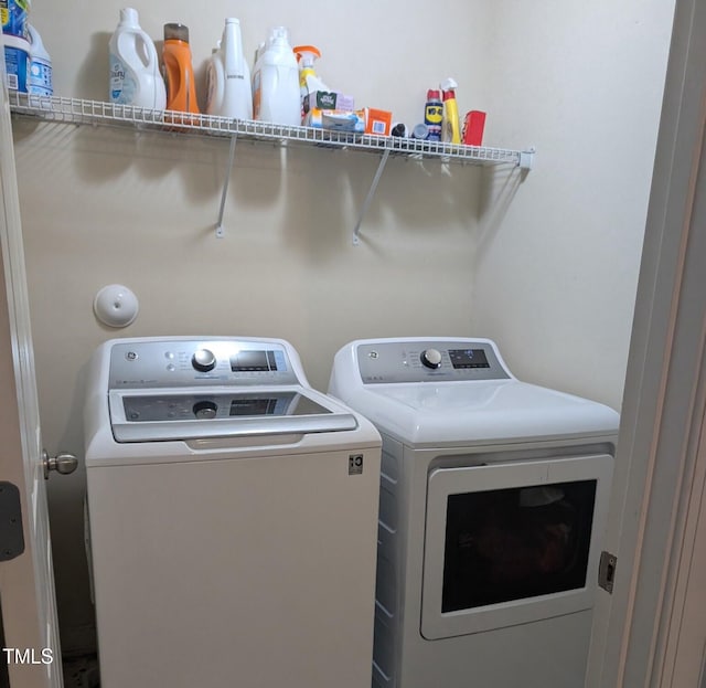 washroom with separate washer and dryer