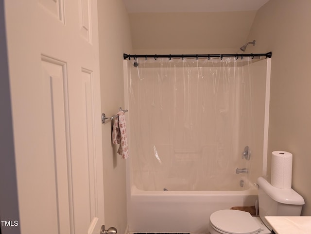 bathroom featuring toilet and shower / tub combo