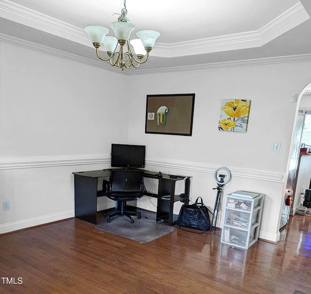 office area with a tray ceiling, crown molding, dark wood-type flooring, and a chandelier