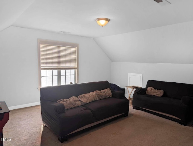 living room featuring carpet flooring and lofted ceiling