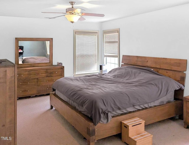 bedroom featuring ceiling fan and light colored carpet