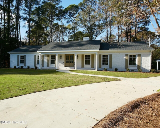 ranch-style home with a porch and a front yard