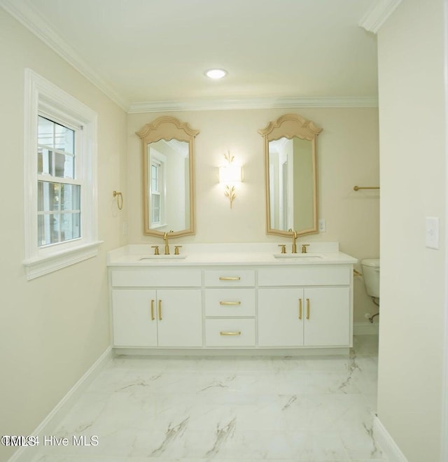 bathroom with vanity, toilet, and ornamental molding