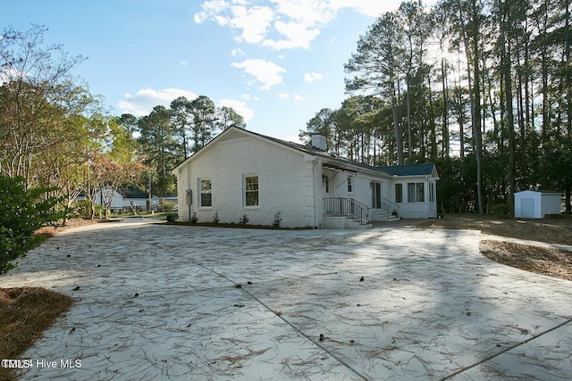 exterior space featuring a storage shed