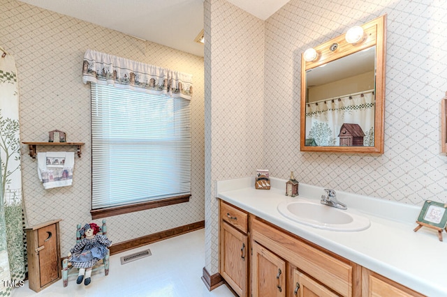 bathroom with vanity and tile patterned floors