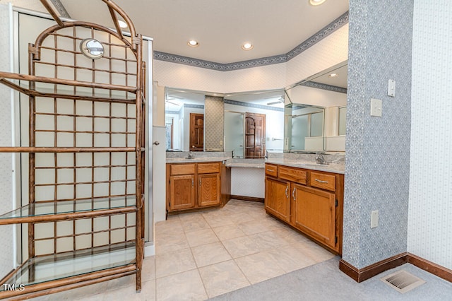 bathroom with vanity and crown molding