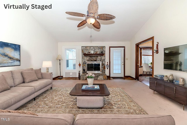 living room with ceiling fan and lofted ceiling