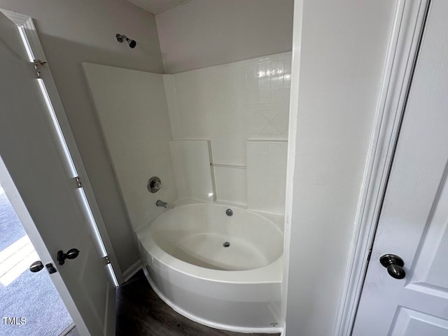 bathroom featuring hardwood / wood-style floors and shower / bathing tub combination