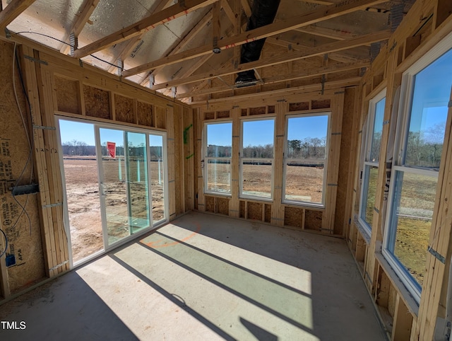 unfurnished sunroom with a rural view