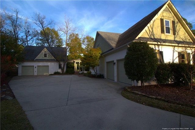 view of side of property featuring a garage