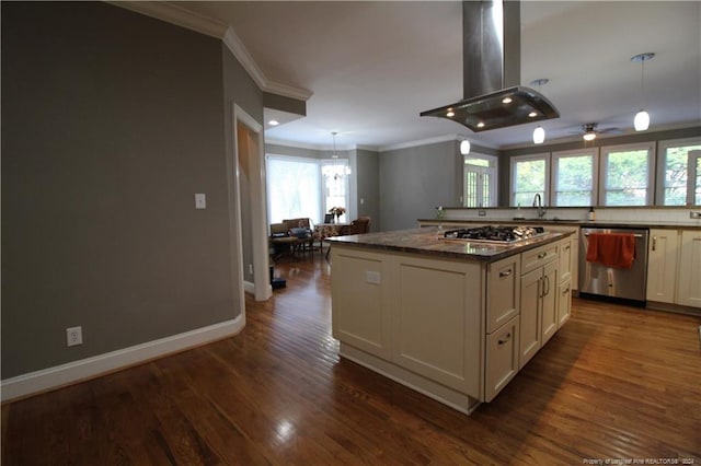 kitchen featuring dark hardwood / wood-style flooring, stainless steel appliances, island range hood, a center island, and hanging light fixtures