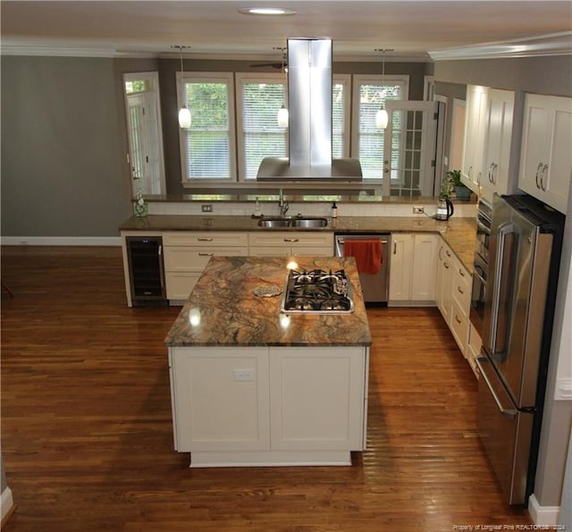 kitchen featuring white cabinetry, sink, dark wood-type flooring, dark stone counters, and appliances with stainless steel finishes