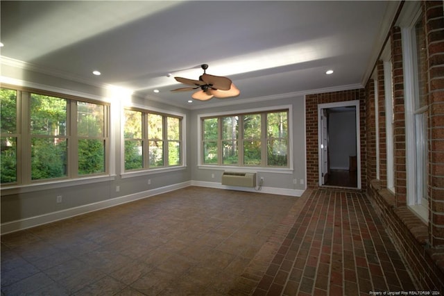 unfurnished sunroom with a wall mounted AC and ceiling fan