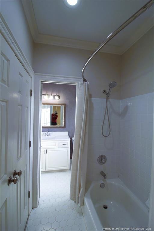 bathroom featuring tile patterned flooring, vanity, shower / bath combination with curtain, and ornamental molding