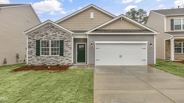 view of front facade with a garage and a front yard