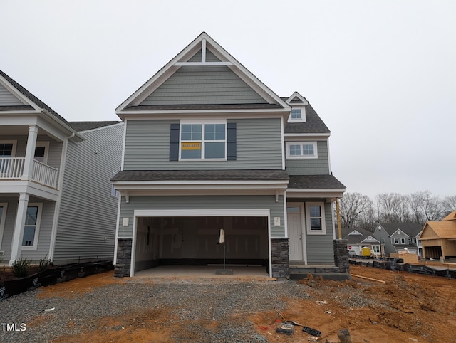 craftsman-style home with a garage