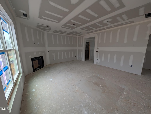 unfurnished living room featuring a healthy amount of sunlight