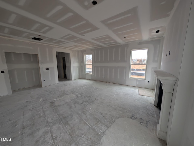 unfurnished living room with a wealth of natural light