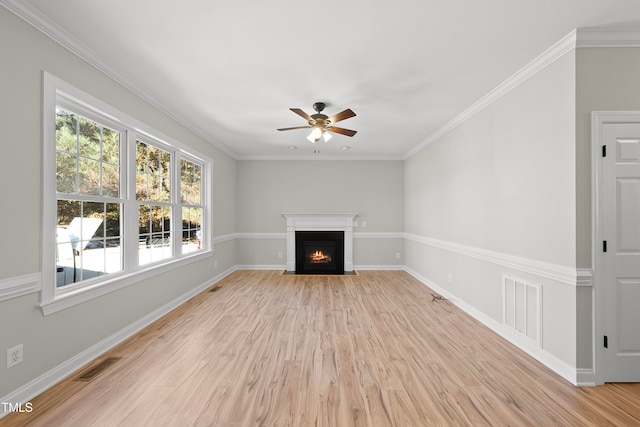 unfurnished living room with ceiling fan, light hardwood / wood-style floors, and ornamental molding