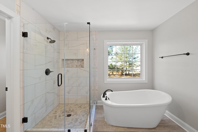 bathroom with shower with separate bathtub