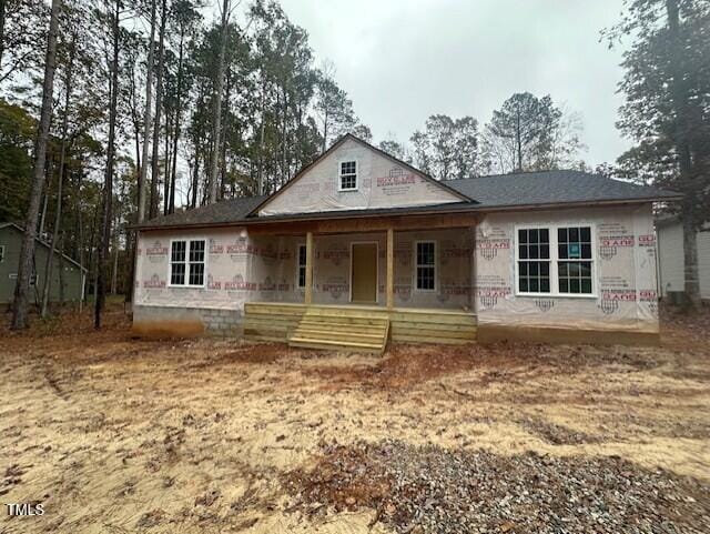 property under construction featuring covered porch