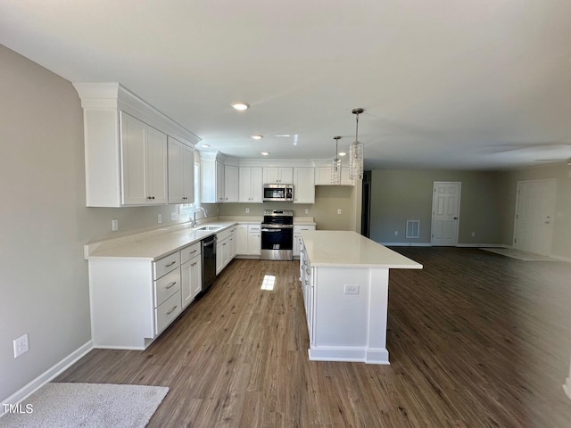 kitchen featuring a sink, white cabinets, visible vents, and stainless steel appliances