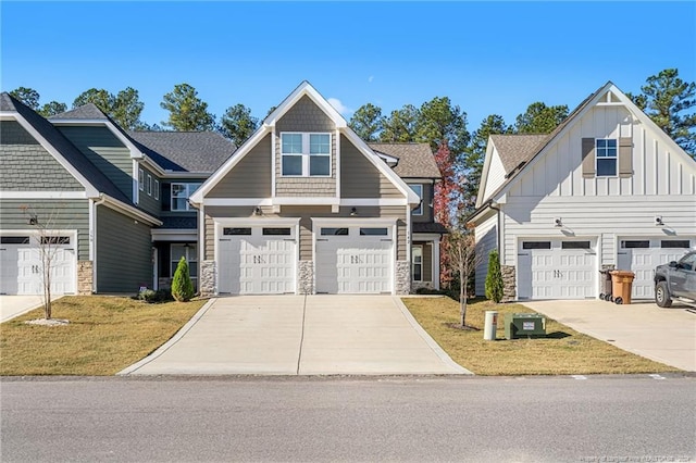 view of front facade with a front yard and a garage