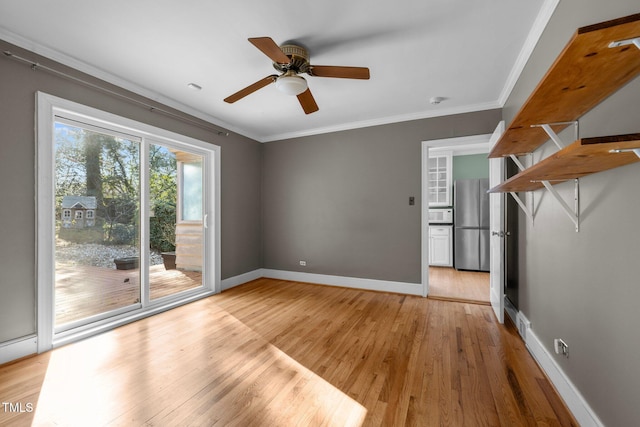 unfurnished room with crown molding, ceiling fan, and light wood-type flooring