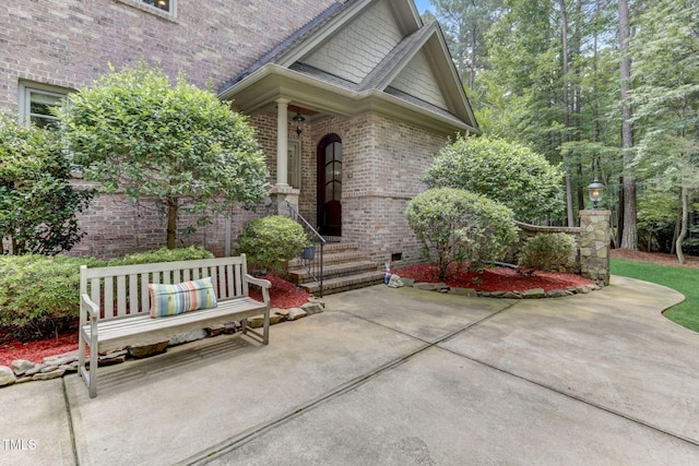 property entrance featuring a patio area