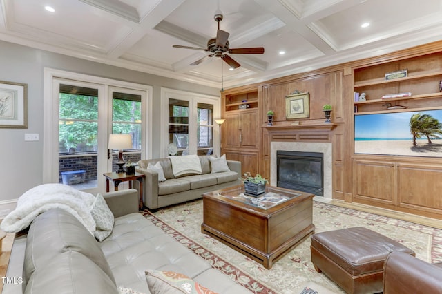 living room featuring built in shelves, crown molding, beamed ceiling, and coffered ceiling