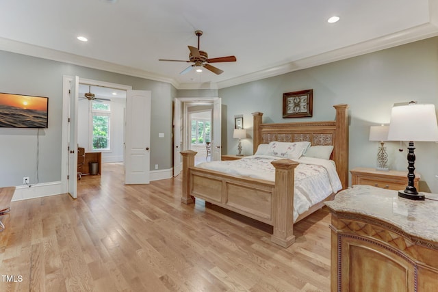 bedroom with crown molding, multiple windows, light hardwood / wood-style flooring, and ceiling fan