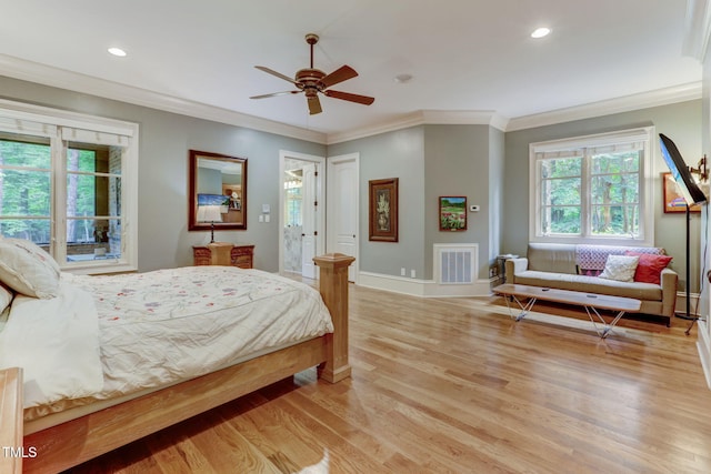 bedroom featuring access to outside, light hardwood / wood-style flooring, ceiling fan, and ornamental molding