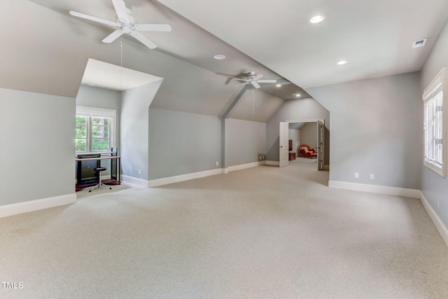 bonus room with ceiling fan, light carpet, and lofted ceiling